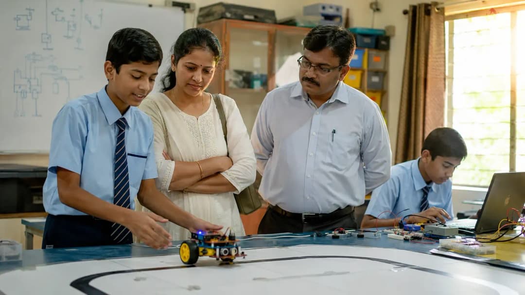 Students working at a robotics workbench in a school lab in Kolhapur, Maharashtra